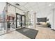 Lobby features tile floor, glass entrance, front desk, and lounge seating at 2 Adams St # 705, Denver, CO 80206