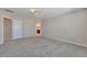 Spacious bedroom featuring plush carpeting, neutral wall color, and ample natural light at 15818 E Otero Cir, Centennial, CO 80112