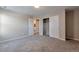 Bedroom featuring carpet, closet, and a doorway at 15818 E Otero Cir, Centennial, CO 80112