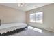 Neutral bedroom featuring a modern bed frame, soft carpet, and a bright window that fills the room with natural light at 15818 E Otero Cir, Centennial, CO 80112