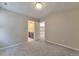 Spacious bedroom with soft carpet, and a doorway leading to another room at 15818 E Otero Cir, Centennial, CO 80112