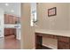 Cozy office nook with built in desk and views of the kitchen at 15818 E Otero Cir, Centennial, CO 80112