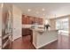 Modern kitchen with stainless steel appliances, granite countertops, and a central island at 15818 E Otero Cir, Centennial, CO 80112