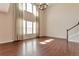Bright living room with soaring ceilings, hardwood floors, and ample natural light at 15818 E Otero Cir, Centennial, CO 80112
