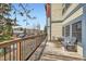 Condo balcony with black metal railing and seating area for enjoying the views at 107 N Harris St # 111, Breckenridge, CO 80424