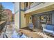 Balcony with chairs, yellow siding, and blue trim of condos at 107 N Harris St # 111, Breckenridge, CO 80424
