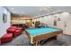 Basement entertainment area with a pool table, a bar, and comfortable seating, perfect for relaxation at 107 N Harris St # 111, Breckenridge, CO 80424