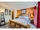 Bedroom with rustic wood furnishings, light colored walls, and wood accent wall at 107 N Harris St # 111, Breckenridge, CO 80424