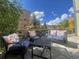 Spacious wood deck featuring outdoor seating with floral cushions and views of the beautiful surroundings at 107 N Harris St # 111, Breckenridge, CO 80424