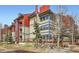 Multi-story condo building showcasing private decks, offering outdoor living and mountain views at 107 N Harris St # 111, Breckenridge, CO 80424