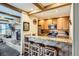 Open kitchen featuring granite counters, stainless steel appliances, and breakfast bar at 107 N Harris St # 111, Breckenridge, CO 80424