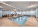 Indoor pool and spa area with tables and chairs nearby, offering a relaxing recreational space at 107 N Harris St # 111, Breckenridge, CO 80424