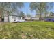 Expansive backyard featuring green grass, a shed, and a wooden fence, perfect for relaxing at 5510 S Windermere St, Littleton, CO 80120