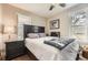Comfortable bedroom with hardwood floors, a bed, and natural light from windows at 5510 S Windermere St, Littleton, CO 80120