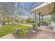 View from the porch showcasing the landscaped front yard, trees, and surrounding neighborhood at 5510 S Windermere St, Littleton, CO 80120