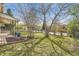 View of the landscaped front yard and lawn with a mature tree providing shade at 5510 S Windermere St, Littleton, CO 80120