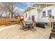Fenced backyard with patio space, seating for six, a blue hammock, and well-kept perimeter landscaping at 3942 Alcott St, Denver, CO 80211