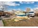Spacious backyard with a patio, hammock, and vehicle parking, great for outdoor relaxation and entertainment at 3942 Alcott St, Denver, CO 80211
