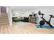 Finished basement featuring recreation area with a sectional, desk area with computers, and exercise area at 3942 Alcott St, Denver, CO 80211