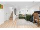 Finished basement with a comfortable green sectional couch, a TV, and stairs at 3942 Alcott St, Denver, CO 80211