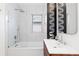 Modern bathroom features white marble tile, a glass-enclosed shower, and a stylish vanity at 3942 Alcott St, Denver, CO 80211