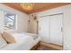 Bright bedroom with a woven wall hanging and a view of the neighborhood at 3942 Alcott St, Denver, CO 80211