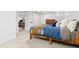 Bedroom features neutral carpet, light walls, closet space, a full bed, and access to other living space at 3942 Alcott St, Denver, CO 80211