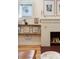 Close-up of the fireplace showcasing the detailed brickwork, wooden mantle, and decorative elements creating a focal point at 3942 Alcott St, Denver, CO 80211