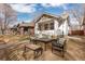 Inviting home with covered porch, fire pit, and outdoor seating, perfect for gatherings at 3942 Alcott St, Denver, CO 80211