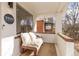 Cozy front porch featuring a comfortable bench, perfect for relaxing and enjoying the neighborhood views at 3942 Alcott St, Denver, CO 80211