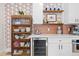 Elegant kitchen boasting white cabinets, a wine cooler, and colorful tile backsplash and floating shelves at 3942 Alcott St, Denver, CO 80211