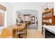 Bright and airy kitchen and dining room with open-concept design, natural light, and hardwood floors at 3942 Alcott St, Denver, CO 80211