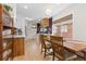Bright kitchen featuring a breakfast nook, hardwood floors, wooden details and large windows at 3942 Alcott St, Denver, CO 80211