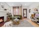Stylish living room with a fireplace, modern furnishings, and ample natural light creating a comfortable living space at 3942 Alcott St, Denver, CO 80211