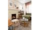 Bright living room featuring a fireplace, stylish decor, and a comfortable seating area with a patterned rug at 3942 Alcott St, Denver, CO 80211