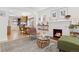 Open-concept living area showcasing the kitchen and a cozy seating arrangement around a fireplace, perfect for entertaining at 3942 Alcott St, Denver, CO 80211