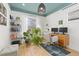 Sunlit office space with a desk, shelving and hardwood floors at 3942 Alcott St, Denver, CO 80211