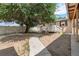 Expansive backyard featuring mature trees, providing ample shade and a serene outdoor space at 6871 Locust St, Commerce City, CO 80022