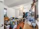 Small cluttered bedroom with a ceiling fan and a window at 6871 Locust St, Commerce City, CO 80022