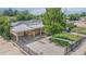 Aerial view of a well-maintained single-story home with a large backyard and mature trees at 6871 Locust St, Commerce City, CO 80022