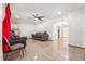 Spacious living room with tile floors, modern lighting, and comfortable seating at 6871 Locust St, Commerce City, CO 80022