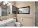 Bathroom featuring a tiled backsplash, modern vanity, and glass-enclosed shower at 7665 S Steele St, Centennial, CO 80122