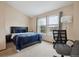 Bedroom with carpet, vaulted ceiling, desk and chair, and a big window at 7665 S Steele St, Centennial, CO 80122