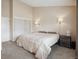 Bright bedroom features neutral walls, carpet and a double closet at 7665 S Steele St, Centennial, CO 80122