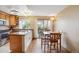 Eat-in kitchen features granite countertops, wood cabinets, and sliding doors to outdoor area at 7665 S Steele St, Centennial, CO 80122