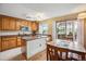 Bright eat-in kitchen with stainless steel appliances and wooden cabinets offer ample storage at 7665 S Steele St, Centennial, CO 80122