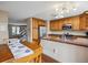 Eat-in kitchen features granite countertops, stainless steel appliances, and wooden cabinetry at 7665 S Steele St, Centennial, CO 80122