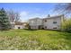 View of a spacious backyard with a well-maintained lawn, shed, and a deck on the home at 12065 E Kentucky Ave, Aurora, CO 80012