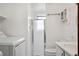 Laundry room with front loading washer and dryer and adjacent shower and toilet at 12065 E Kentucky Ave, Aurora, CO 80012