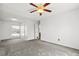 Cozy bedroom featuring a window, closet, and soft carpet at 12065 E Kentucky Ave, Aurora, CO 80012